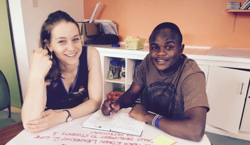 Two Amani Fellows discussing a project