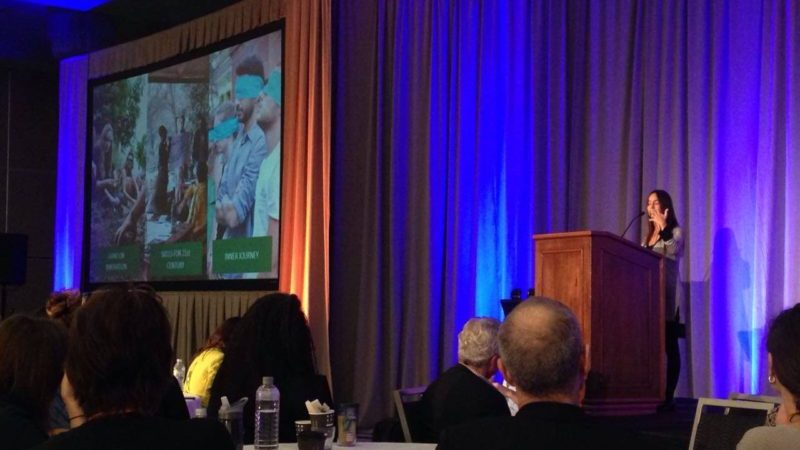 Ilaina Rabbat accepting the award on behalf of Amani Institute