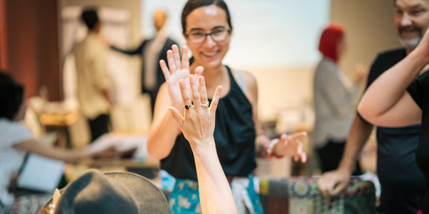 Two woman doing a high-five